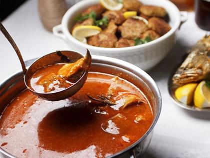 Zuppa di vongole e pesce all'arancia